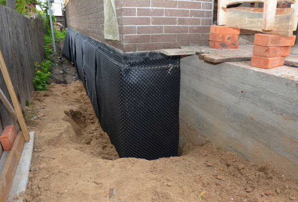 Happy homeowners after waterproofing job in Baldwin